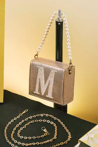 Gold customised 'm' synthetic clutch