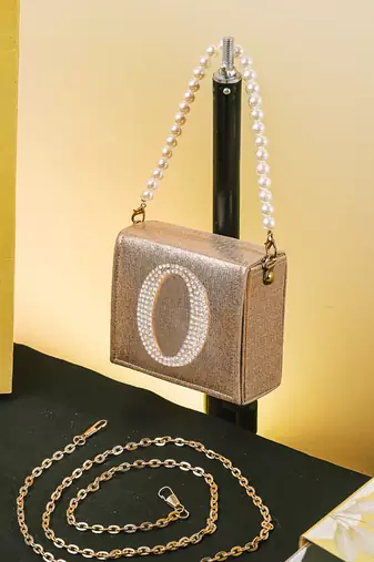 Gold customised 'o' synthetic clutch