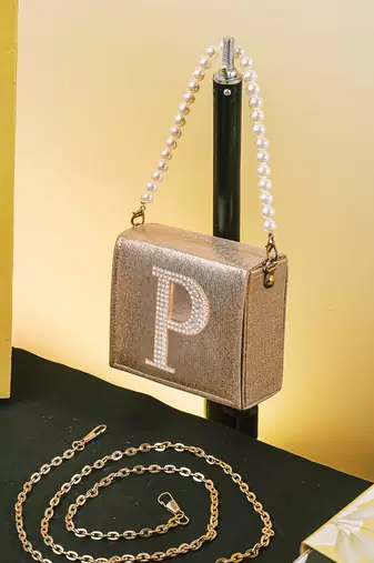 Gold customised 'p' synthetic clutch