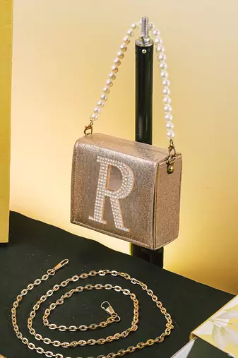 Gold customised 'r' synthetic clutch