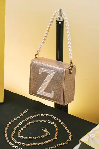 Gold customised 'z' synthetic clutch
