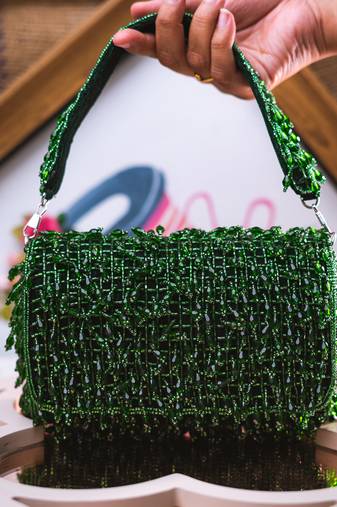 Green embroidered clutch