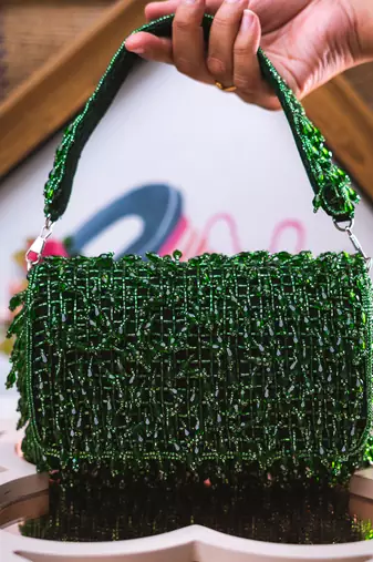 Green embroidered clutch