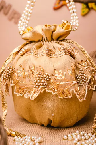 Gold floral embroidered potli bag