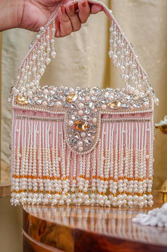 White pearl embroidered clutch