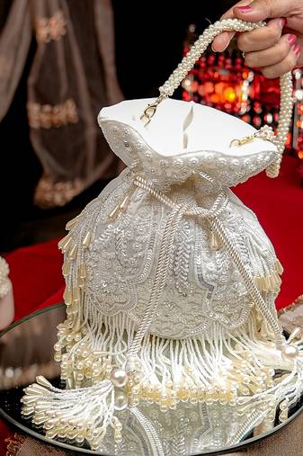 White floral embroidered potli bag