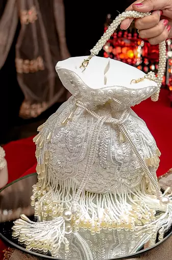 White floral embroidered potli bag