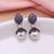 Purple color american diamond earrings