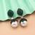 Green color american diamond earrings
