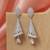 Silver color american diamond earrings