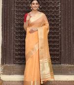 Orange color rich ethnic cotton based saree with rich woven looks