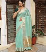 Sea green color rich ethnic cotton based saree with rich woven looks