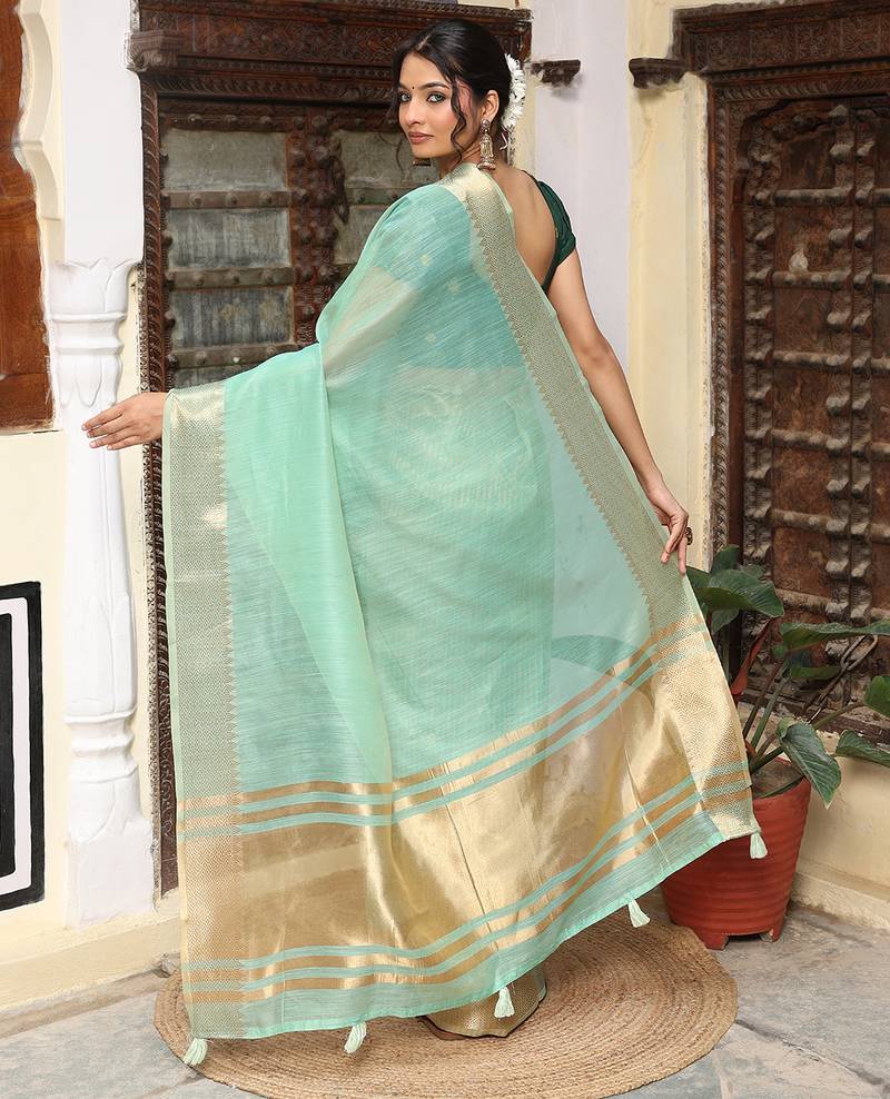 Sea green color rich ethnic cotton based saree with rich woven designer looks
