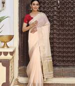 Peach color rich ceremonial looks cotton based woven saree