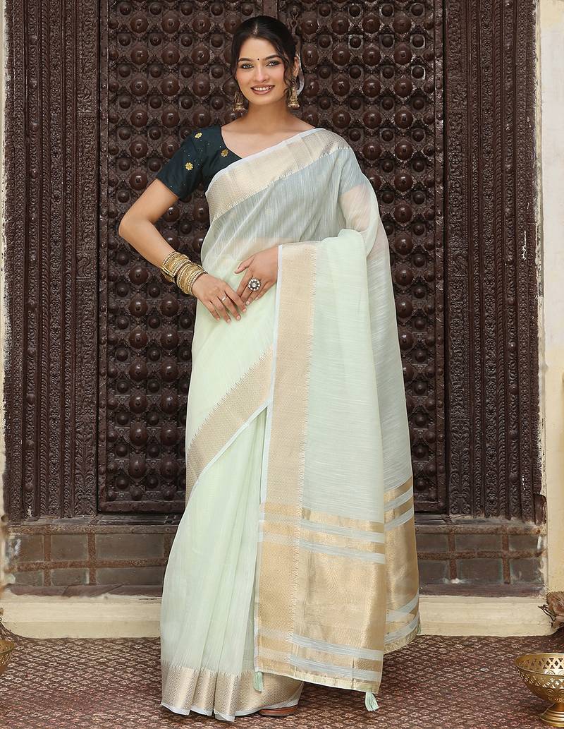 Light green color rich ceremonial looks cotton based woven designer saree