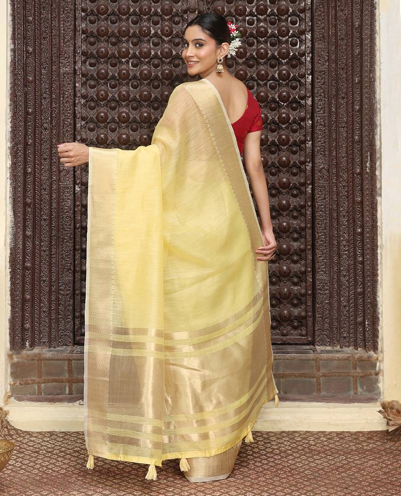 Yellow color rich ceremonial looks cotton based woven designer saree