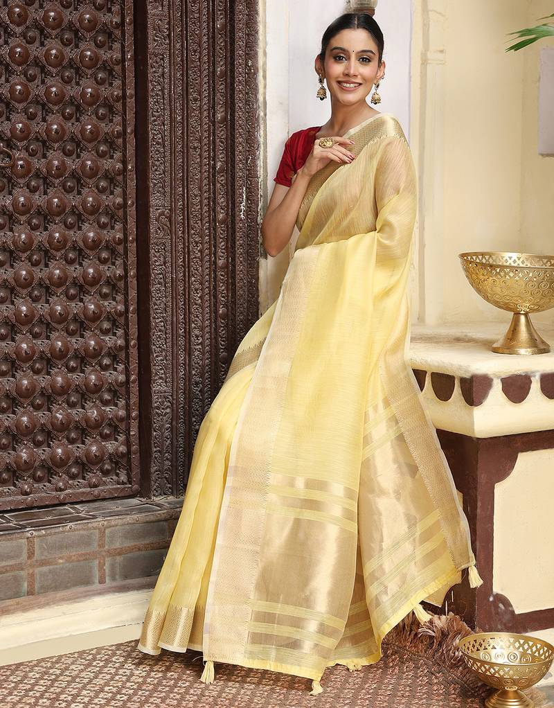 Yellow color rich ceremonial looks cotton based woven designer saree