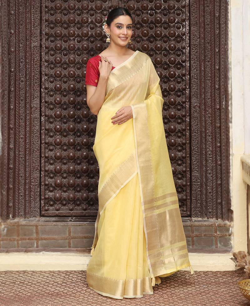 Yellow color rich ceremonial looks cotton based woven designer saree