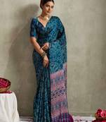 teal color rich looks bandhani printed elegant festive saree