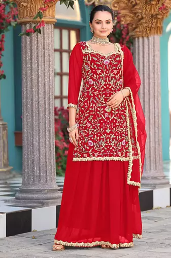 Red color graceful heavy embroidered palazzo suit