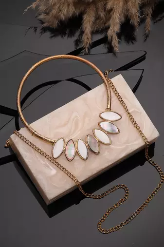 marble muse pearl cream resin marble textured clutch