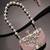 marble muse rose pink, embellished clutch