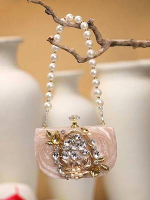 marble muse beige, ivory & gold resin embellished clutch 1