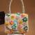 petal posh ivory & multi canvas floral motif beaded clutch