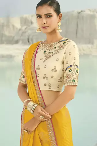 yellow organza viscose satin saree with silk blend blouse