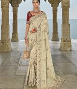 cream banarasi jari saree with lucknowi & jarkhan heavy work and silk blend blouse