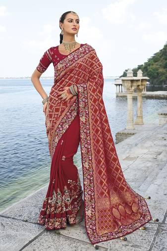 maroon bandhej pallu and dola silk blend skirt saree with mirror, jari & moti heavy work and silk blend blouse