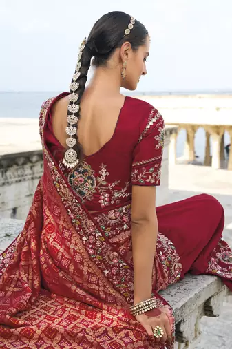 maroon bandhej pallu and dola silk blend skirt saree with mirror jari & moti work and silk blend blouse