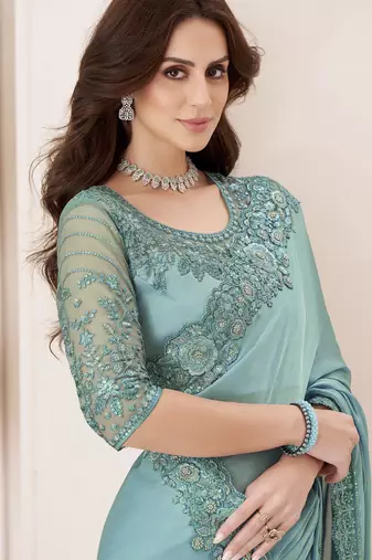 Sky blue satin georgette silk saree with luxurious banglori silk blouse for weddings and festive occasions