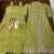 Green chinon silk two piece full stitched gownd with belt size upto 44