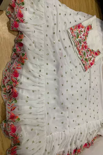 White faux georgette with embroidered sequin work ruffle saree with unstitched blouse