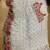 White faux georgette with embroidered sequence work ruffle saree with unstitched blouse