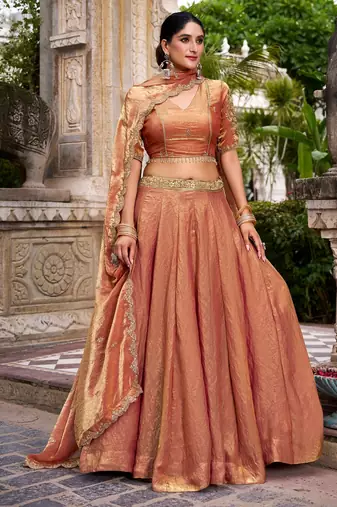 Elegant Rust orange Fendi Silk Lehenga Choli with Zari and Lace Detailing Dupatta
