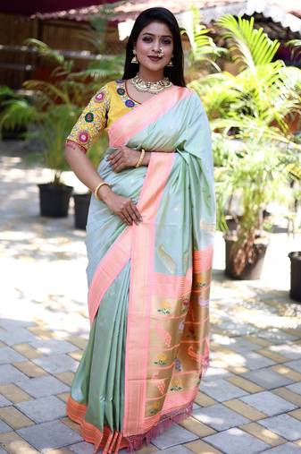 light green woven paithani silk blend saree with blouse
