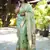 green woven paithani silk blend saree with blouse