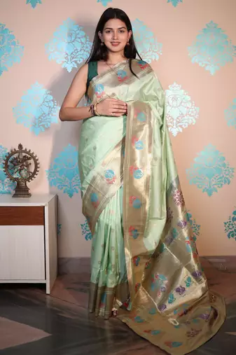 light green woven banarasi silk blend saree with blouse