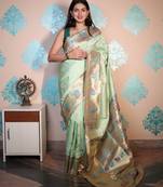 light green woven banarasi silk blend saree with blouse