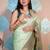 light green woven banarasi silk blend saree with blouse