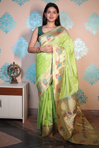 green woven banarasi silk blend saree with blouse