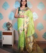 green woven banarasi silk blend saree with blouse