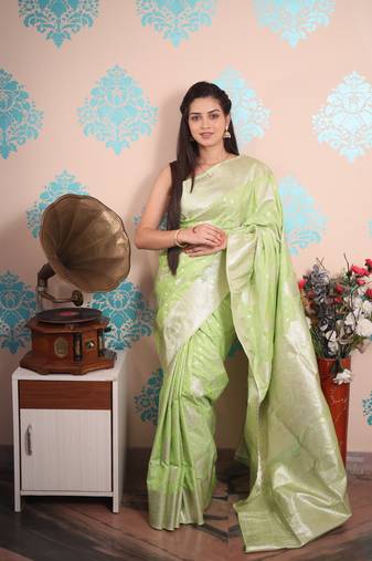 light green woven banarasi silk blend saree with blouse