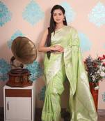 light green woven banarasi silk blend saree with blouse