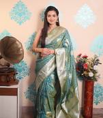 turquoise woven banarasi silk blend saree with blouse
