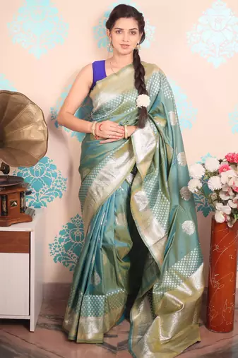 green woven banarasi silk blend saree with blouse