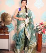 green woven banarasi silk blend saree with blouse