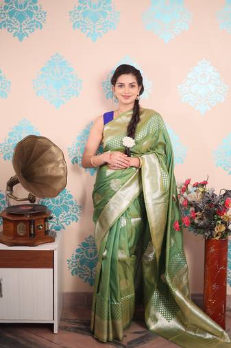 green woven banarasi silk blend saree with blouse